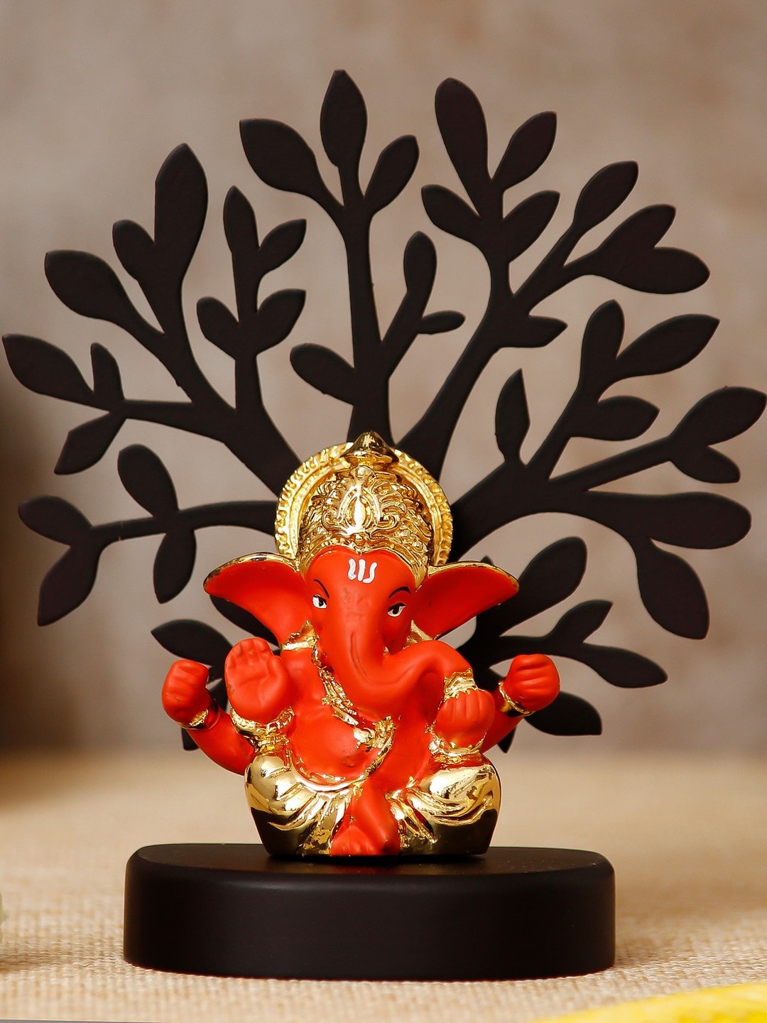 eCraftIndia Gold-Plated Orange & Black Handcrafted Mukut Ganesha with Wooden Tree Showpiece
eCraftIndia Gold-Plated Orange & Black Handcrafted Mukut Ganesha with Wooden Tree Showpiece