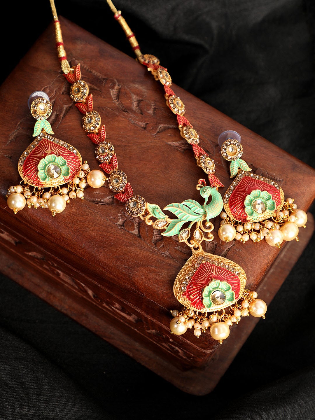 ANIKAS CREATION Gold-Plated Red & Green Stone-Studded Beaded Enamelled Sustainable Jewellery Set
ANIKAS CREATION Gold-Plated Red & Green Stone-Studded Beaded Enamelled Sustainable Jewellery Set