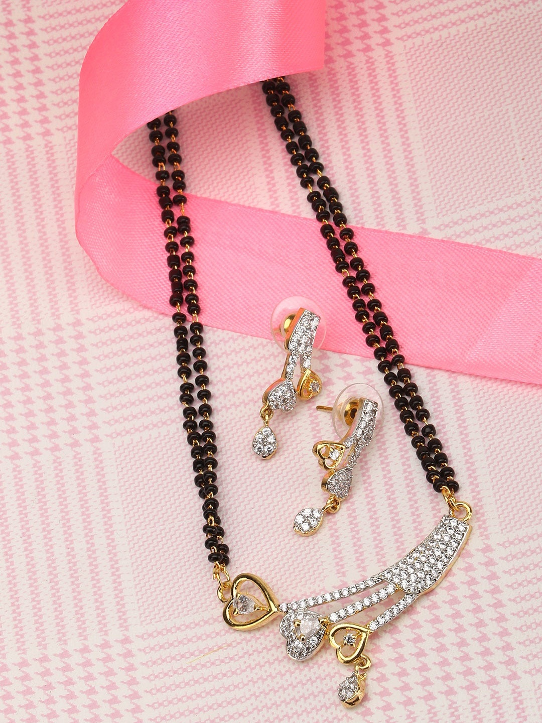 Adwitiya Collection Gold-Plated Black & White AD Stone-Studded Beaded Mangalsutra Set
Adwitiya Collection Gold-Plated Black & White AD Stone-Studded Beaded Mangalsutra Set