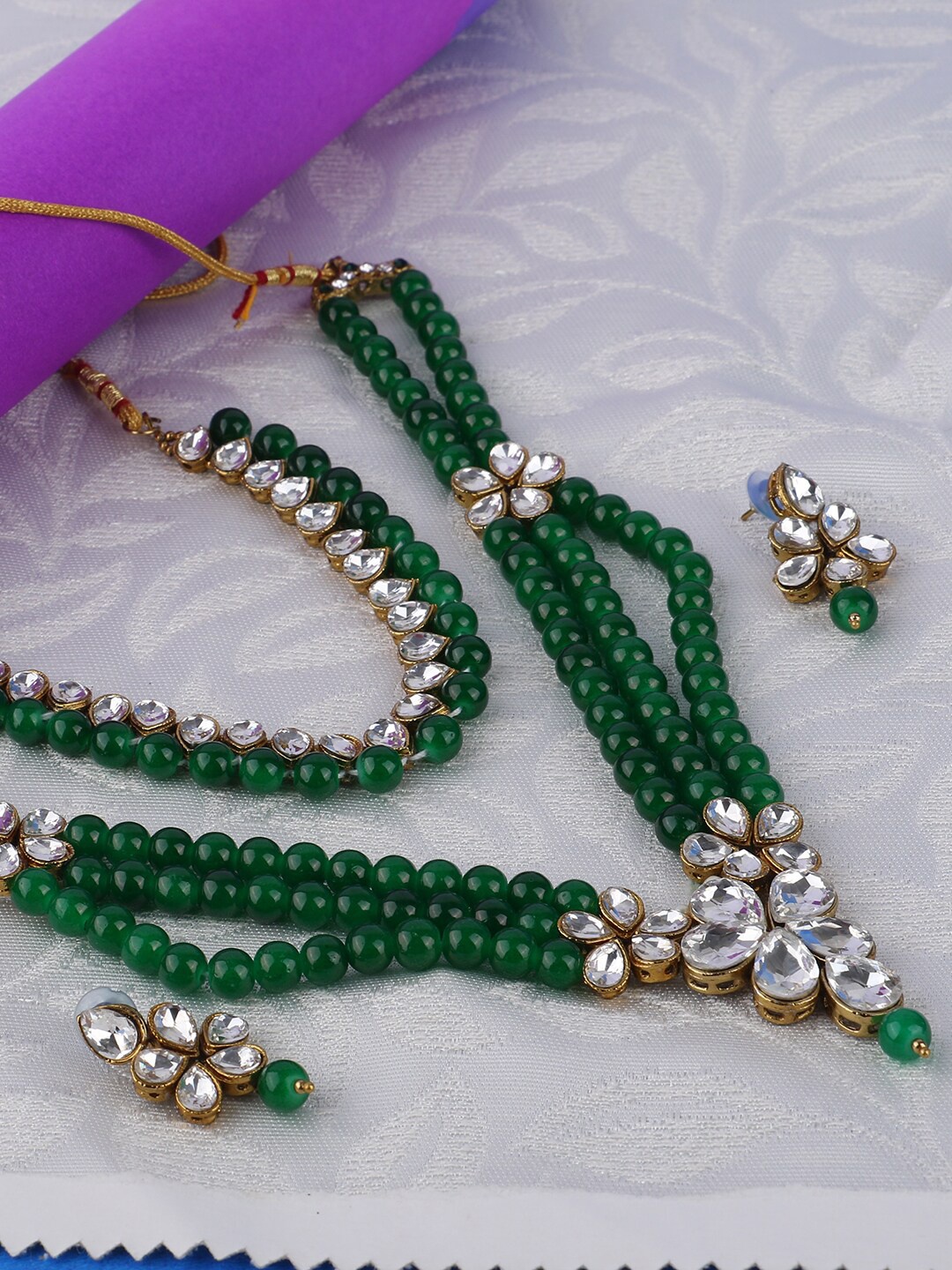 ANIKAS CREATION Gold-Plated Green & White Kundan-Studded & Beaded Multi-Stranded Jadau Jewellery Set
ANIKAS CREATION Gold-Plated Green & White Kundan-Studded & Beaded Multi-Stranded Jadau Jewellery Set