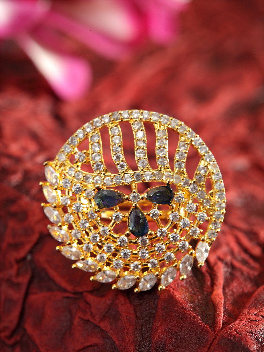 Bhana Fashion Gold-Plated White & Blue American Diamond Stone Studded Handcrafted Circular Finger Ring
Bhana Fashion Gold-Plated White & Blue American Diamond Stone Studded Handcrafted Circular Finger Ring
