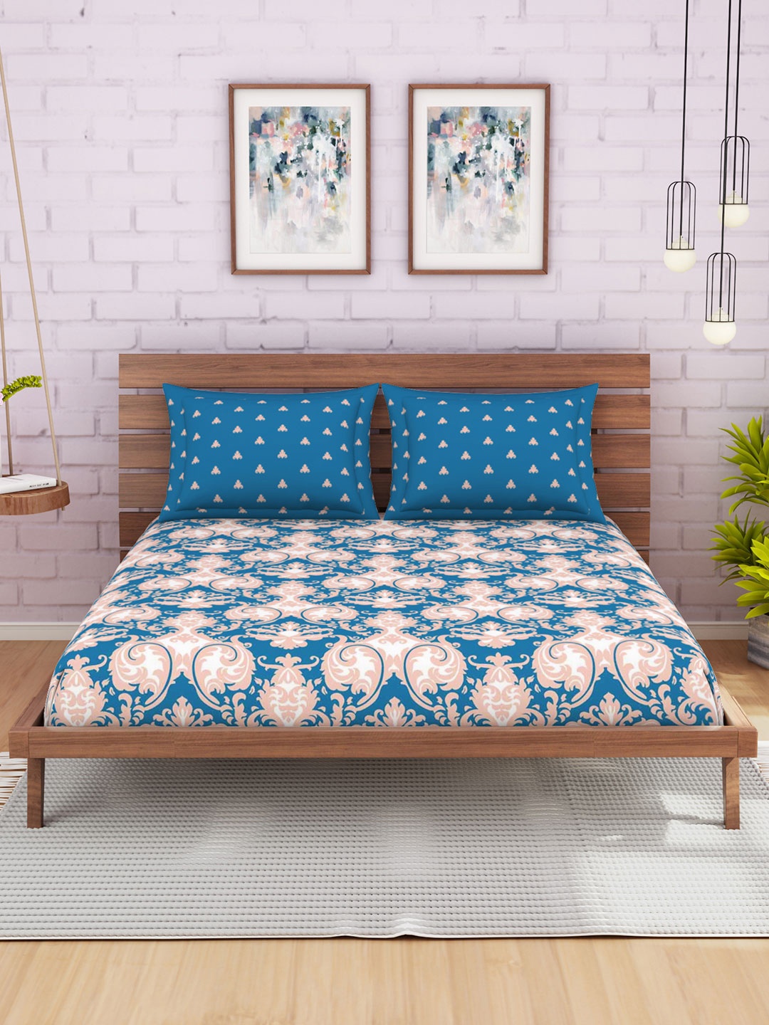 SPACES Blue & Peach-Coloured Ethnic Motifs 144 TC Cotton 1 Queen Bedsheet with 2 Pillow Covers
SPACES Blue & Peach-Coloured Ethnic Motifs 144 TC Cotton 1 Queen Bedsheet with 2 Pillow Covers