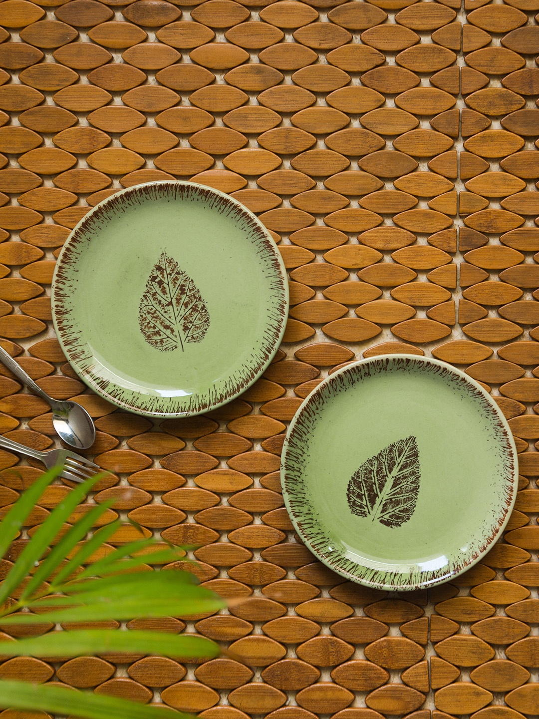 ExclusiveLane Set Of 2 Green & Brown Banyan-Leaves Hand-Painted Ceramic Quarter Plates
ExclusiveLane Set Of 2 Green & Brown Banyan-Leaves Hand-Painted Ceramic Quarter Plates
