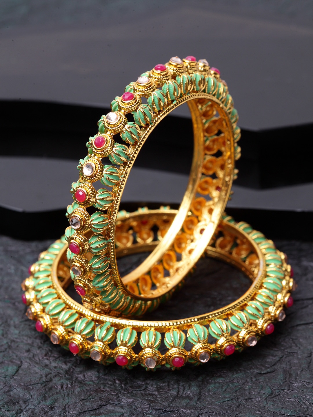 Shining Diva Set of 2 Gold-Plated Green & Pink Enameled Stone-Studded Meenakari Bangles
Shining Diva Set of 2 Gold-Plated Green & Pink Enameled Stone-Studded Meenakari Bangles