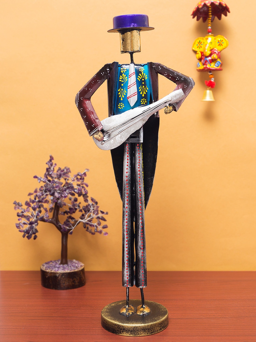 Golden Peacock Burgundy & Silver-Toned Handcrafted Musician Man Decorative Showpiece
Golden Peacock Burgundy & Silver-Toned Handcrafted Musician Man Decorative Showpiece
