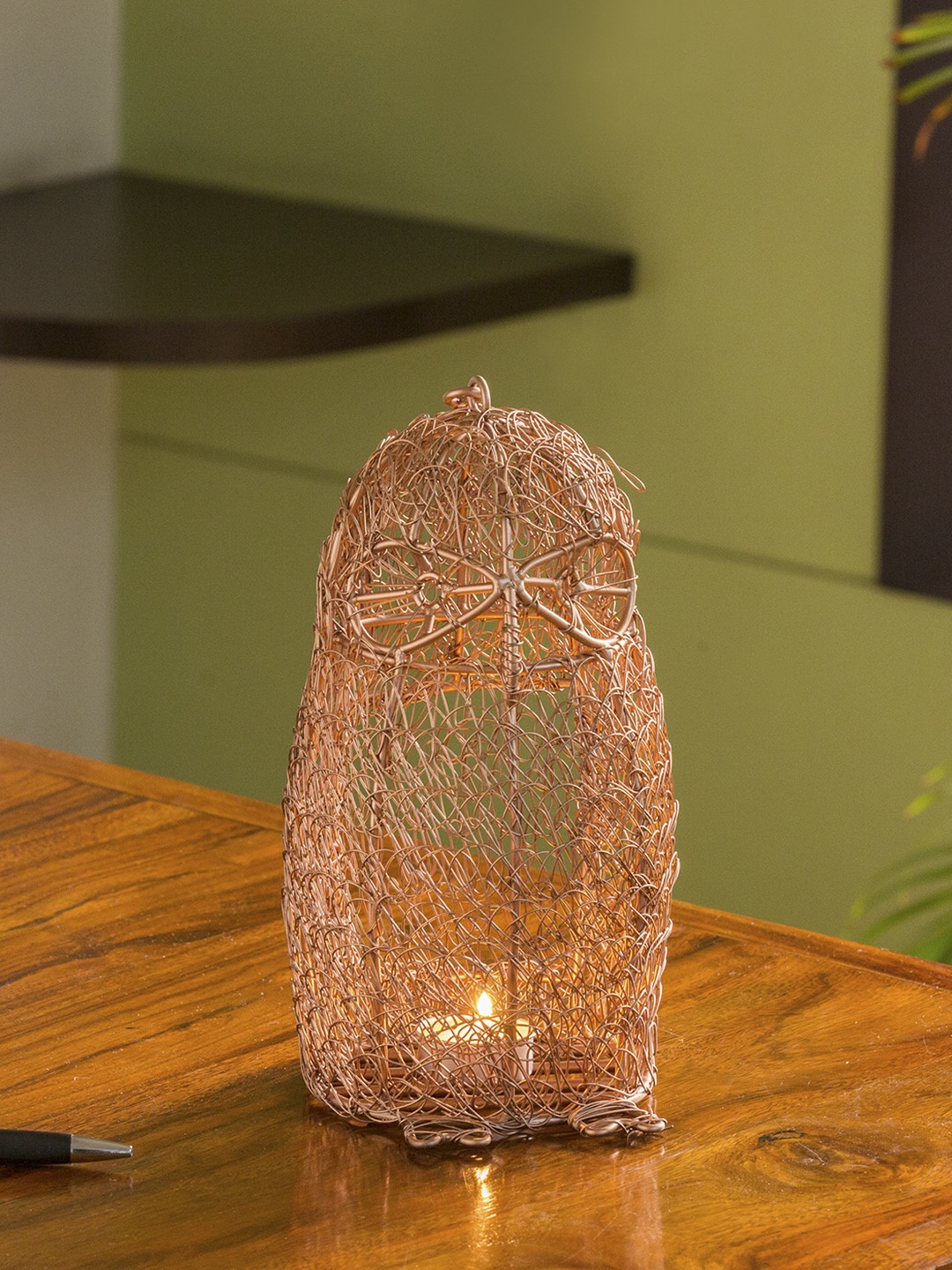 ExclusiveLane The Spectacled Owl Mesh Showpiece cum Hanging & Table Tea-Light Holder, Copper
ExclusiveLane The Spectacled Owl Mesh Showpiece cum Hanging & Table Tea-Light Holder, Copper