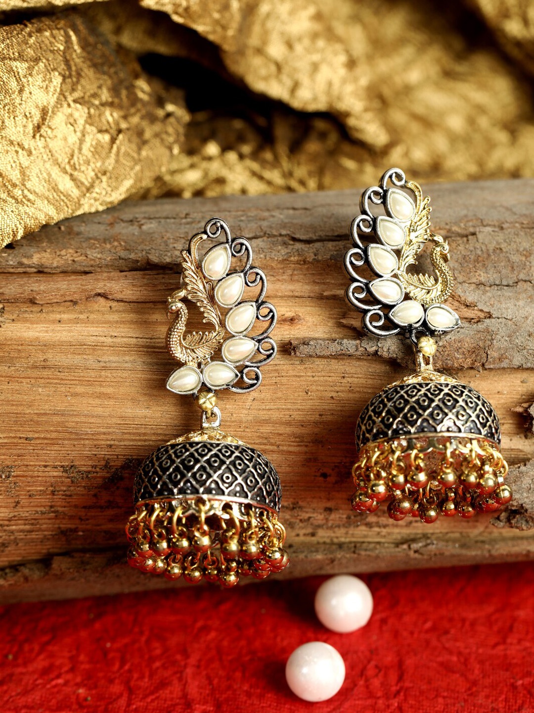 ANIKAS CREATION Gold-Plated & White Antique Peacock Shaped Jhumkas