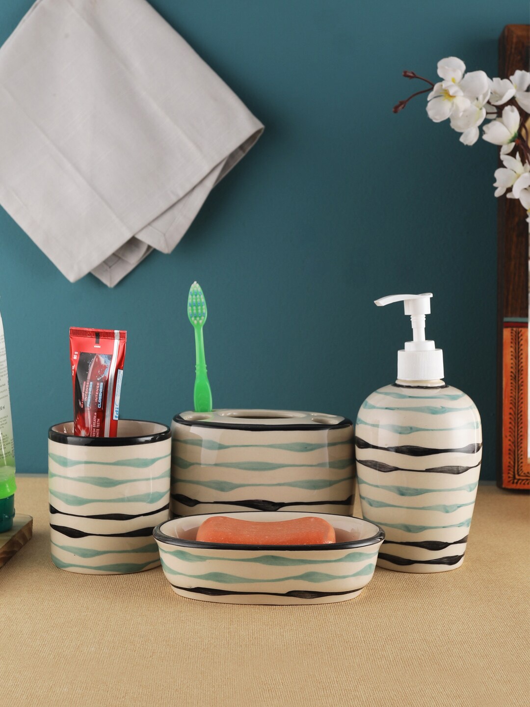 VarEesha Off-White & Sea-Green Striped Mugdha Ceramic Four Piece Bathroom Accessories Set
VarEesha Off-White & Sea-Green Striped Mugdha Ceramic Four Piece Bathroom Accessories Set