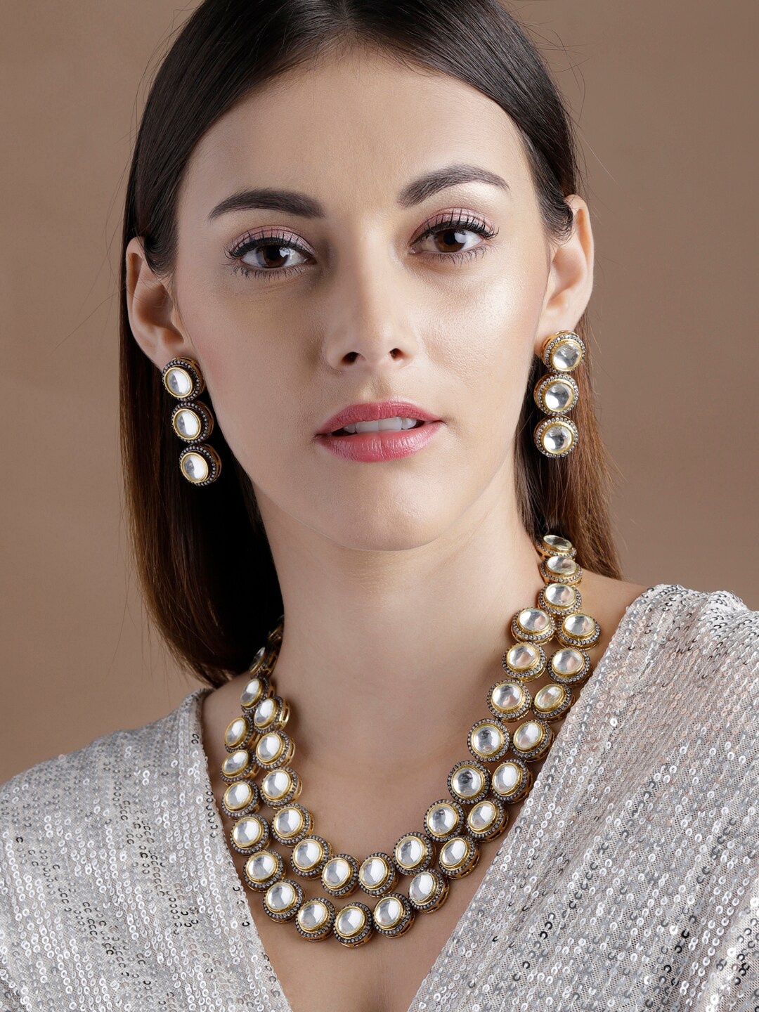 Rubans 24K Gold Plated Whiter Kundan & Cubic Zirconia Studded Multi Layer Necklace Set
Rubans 24K Gold Plated Whiter Kundan & Cubic Zirconia Studded Multi Layer Necklace Set