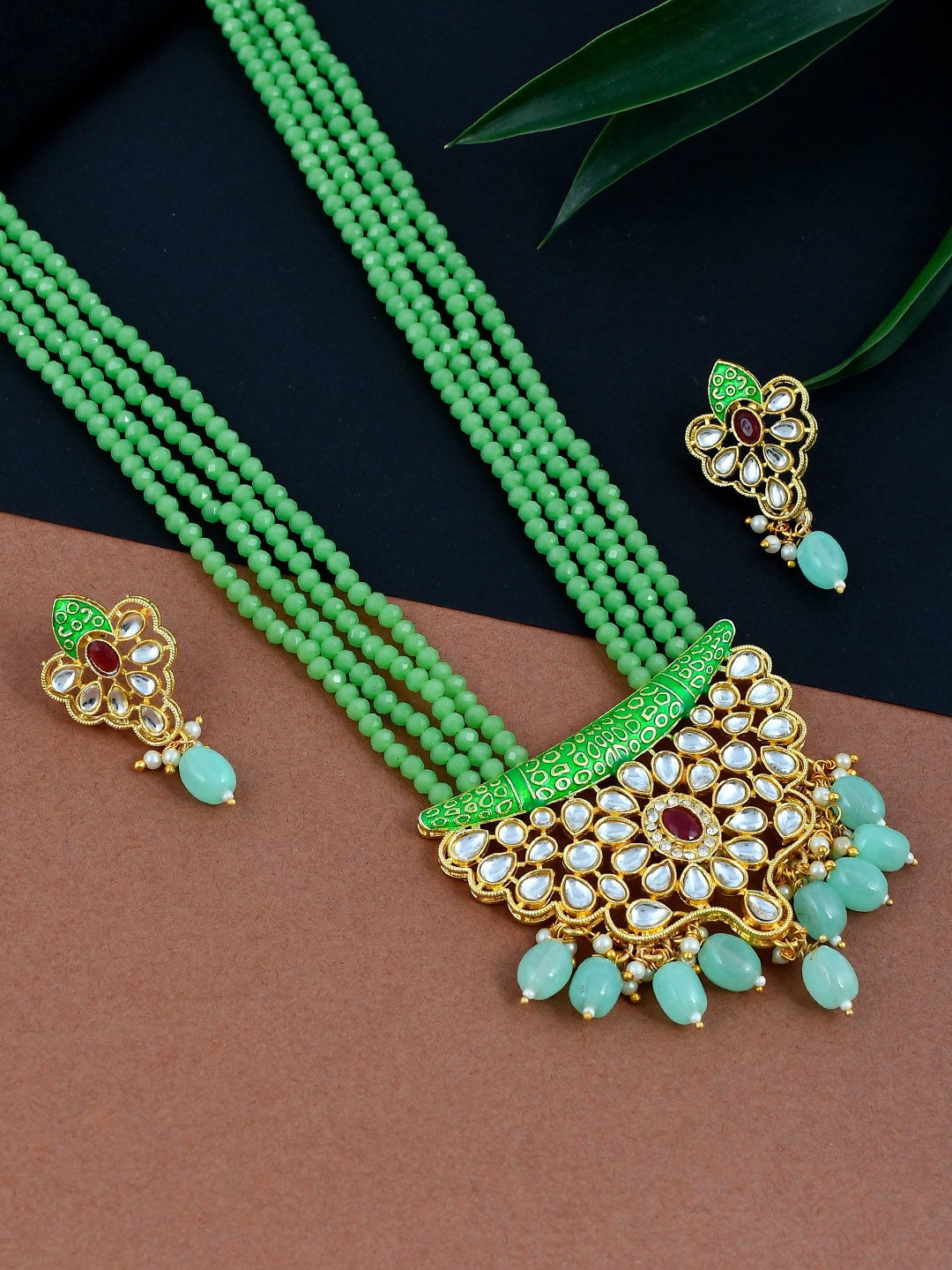Silvermerc Design Gold-Plated Green & White Kundan-studded & Pearl Beaded Antique Jewellery Set
Silvermerc Design Gold-Plated Green & White Kundan-studded & Pearl Beaded Antique Jewellery Set