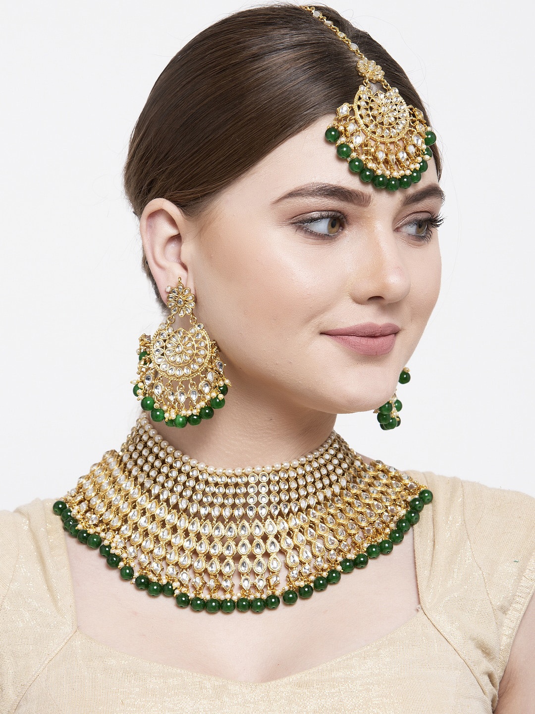 Shining Diva Gold Plated White Kundan Studded & Green Pearl Beaded Choker Jewellery Set
Shining Diva Gold Plated White Kundan Studded & Green Pearl Beaded Choker Jewellery Set
