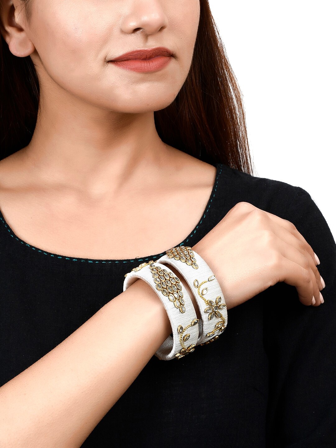 Silvermerc Designs Set of 2 Gold Plated Off White Kundan Studded Jaipuri Bangles
Silvermerc Designs Set of 2 Gold Plated Off White Kundan Studded Jaipuri Bangles