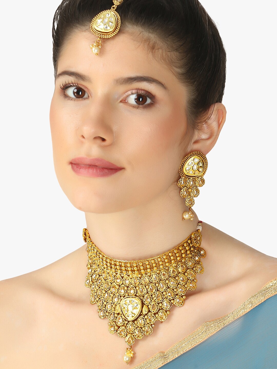 Adwitiya Collection Gold-Plated & White Stone Studded Choker Necklace With Earring & Maang Tika
Adwitiya Collection Gold-Plated & White Stone Studded Choker Necklace With Earring & Maang Tika