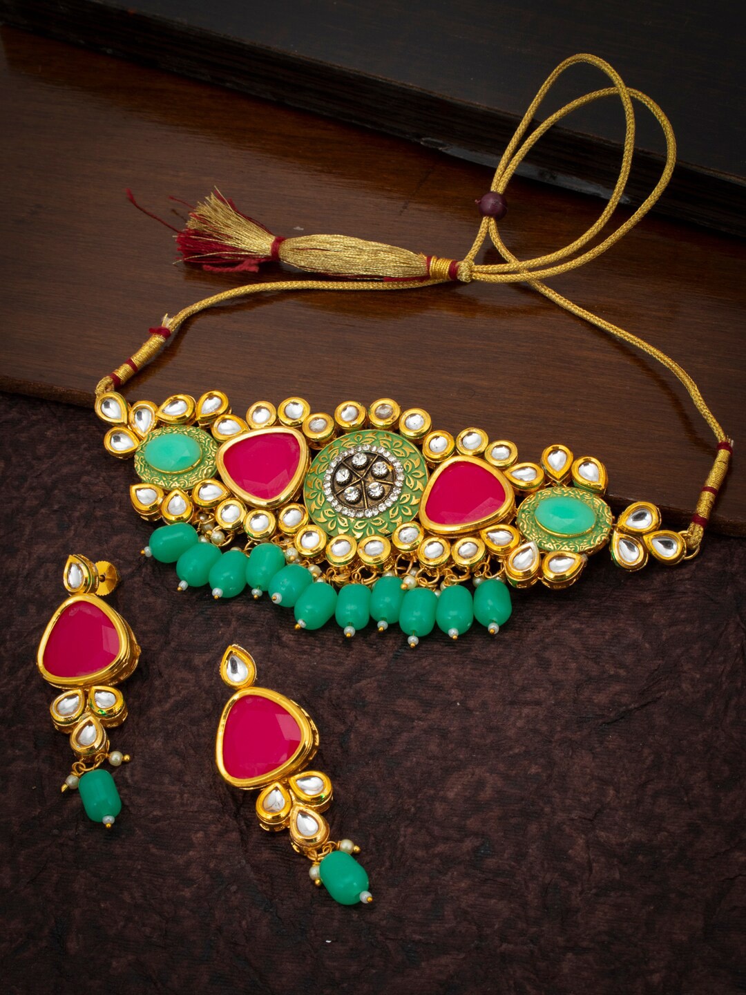 Sukkhi Gold-Plated Green & Red Kundan & Stone-Studded Beaded Meenakari Sustainable Jewellery Set
Sukkhi Gold-Plated Green & Red Kundan & Stone-Studded Beaded Meenakari Sustainable Jewellery Set