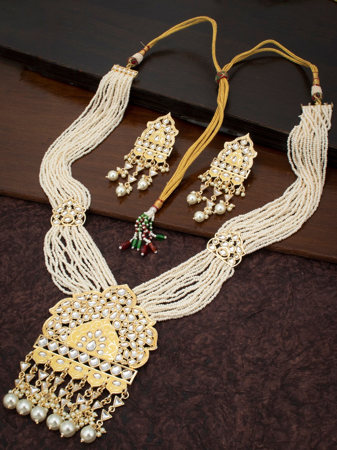 Sukkhi Gold-Plated Yellow & White Kundan-Studded & Pearl Beaded Meenakari Jewellery Set
Sukkhi Gold-Plated Yellow & White Kundan-Studded & Pearl Beaded Meenakari Jewellery Set