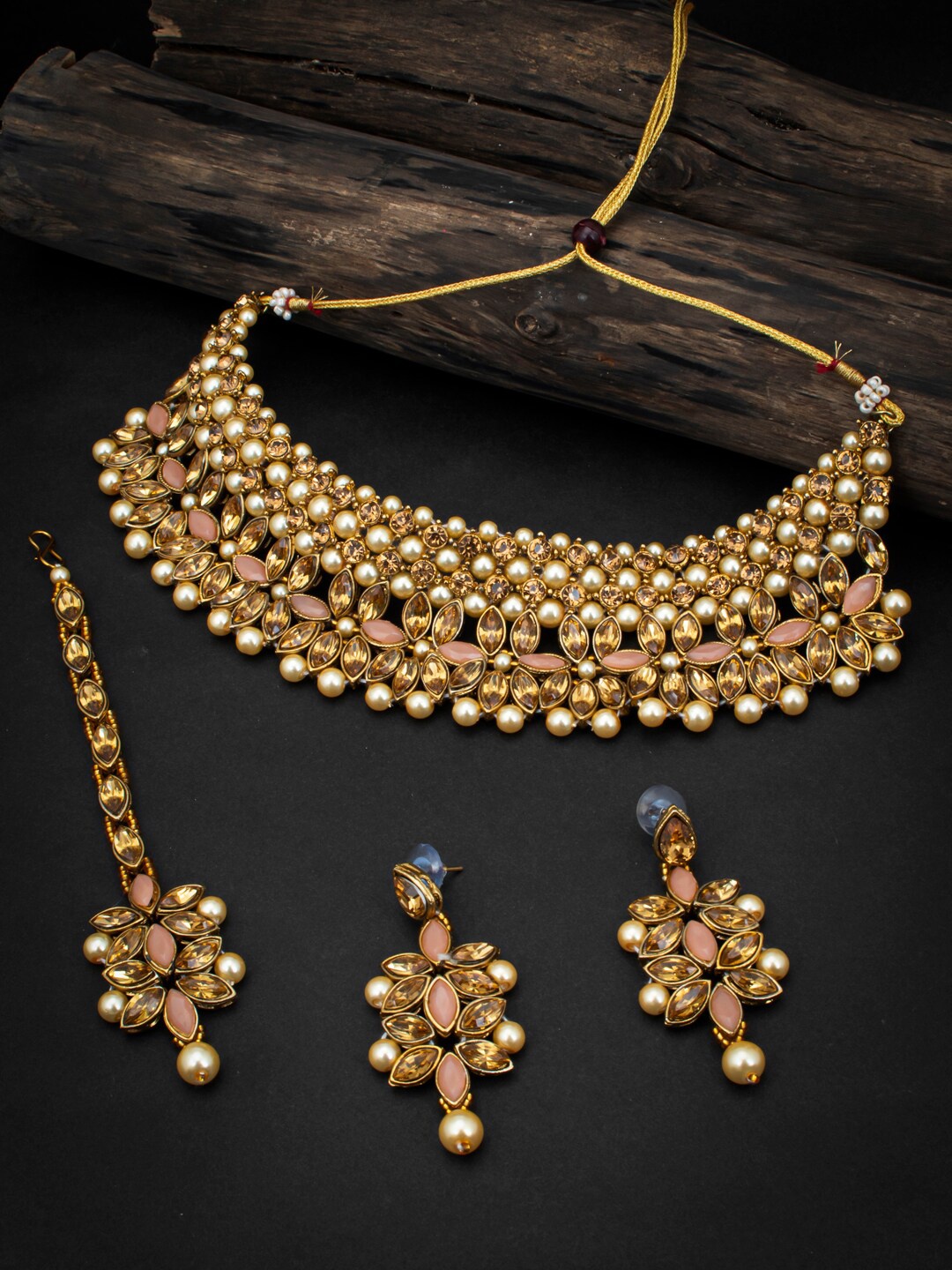 Sukkhi LCT Gold-Plated Off-White & Peach-coloured Stone-Studded & Pearl Beaded Sustainable Jewellery Set
Sukkhi LCT Gold-Plated Off-White & Peach-coloured Stone-Studded & Pearl Beaded Sustainable Jewellery Set