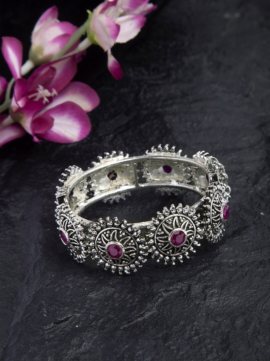 Moedbuille Pink Stone Studded Filigree Work Oxidised Silver Plated Handcrafted Tribal Bracelet
Moedbuille Pink Stone Studded Filigree Work Oxidised Silver Plated Handcrafted Tribal Bracelet