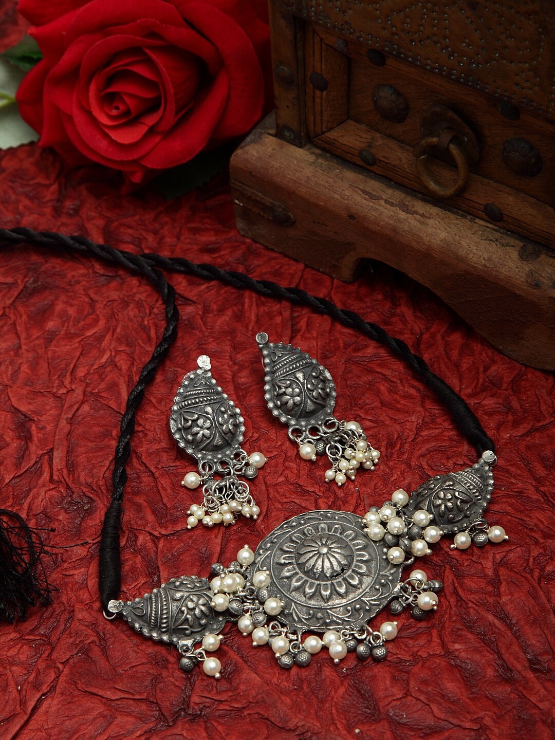 Moedbuille Pearls Studded Tasselled Design Oxidised Silver Plated Handcrafted Afghan Jewelry Set
Moedbuille Pearls Studded Tasselled Design Oxidised Silver Plated Handcrafted Afghan Jewelry Set