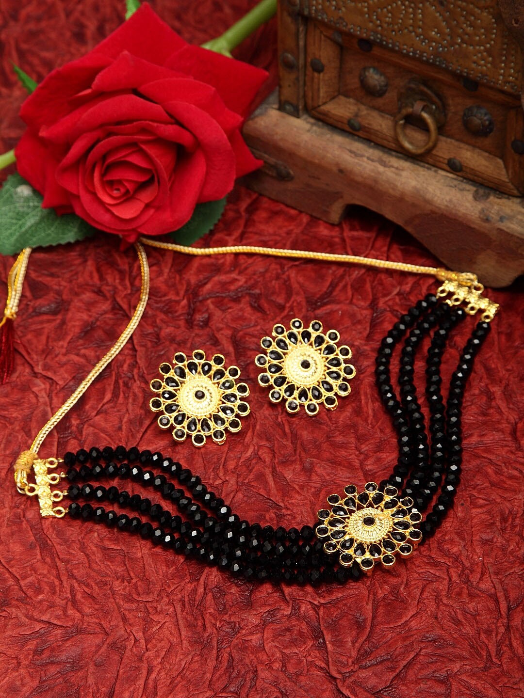 Moedbuille Black Stones and Beads Studded Oxidised Gold Plated Handcrafted Jewelry Set
Moedbuille Black Stones and Beads Studded Oxidised Gold Plated Handcrafted Jewelry Set