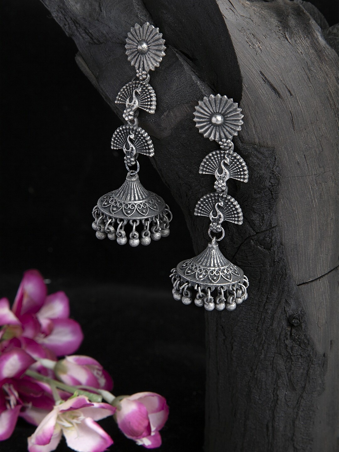 Moedbuille Beads Studded Peacock Design Oxidised Silver Plated Handcrafted Tribal Jhumkas
Moedbuille Beads Studded Peacock Design Oxidised Silver Plated Handcrafted Tribal Jhumkas