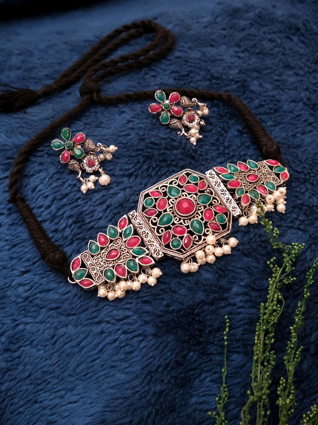Crunchy Fashion Oxidised Gold-Plated Red & Green Kundan-Studded Embellished Jewellery Set
Crunchy Fashion Oxidised Gold-Plated Red & Green Kundan-Studded Embellished Jewellery Set