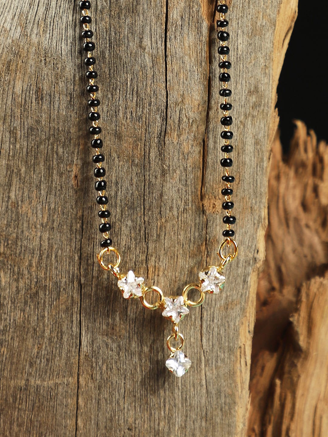 ANIKAS CREATION Gold-Plated Black & White Beaded Stone-Studded Traditional Mangalsutra
ANIKAS CREATION Gold-Plated Black & White Beaded Stone-Studded Traditional Mangalsutra