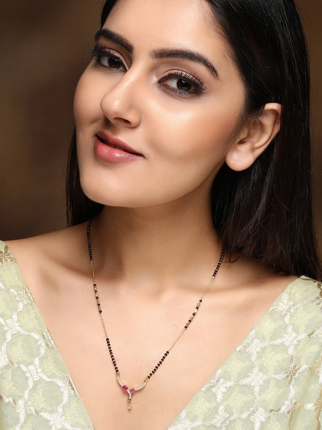 Rubans Gold-Plated Pink & Silver-Coloured Zircon Studded Beaded Handcrafted Mangalsutra
Rubans Gold-Plated Pink & Silver-Coloured Zircon Studded Beaded Handcrafted Mangalsutra