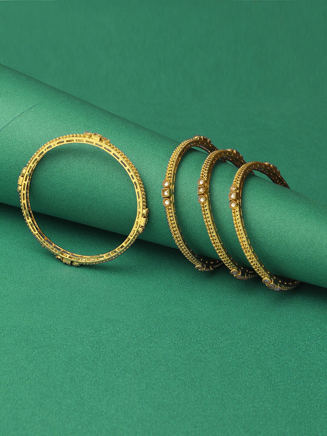 Adwitiya Collection Set of 4 24 CT Gold-Plated White Stone-Studded Handcrafted Bangles
Adwitiya Collection Set of 4 24 CT Gold-Plated White Stone-Studded Handcrafted Bangles