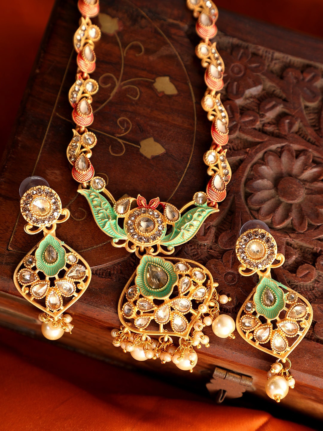 ANIKAS CREATION Gold-Plated Sea Green & Peach-Colored Enamelled Kundan-Studded Traditional Jewellery Set
ANIKAS CREATION Gold-Plated Sea Green & Peach-Colored Enamelled Kundan-Studded Traditional Jewellery Set