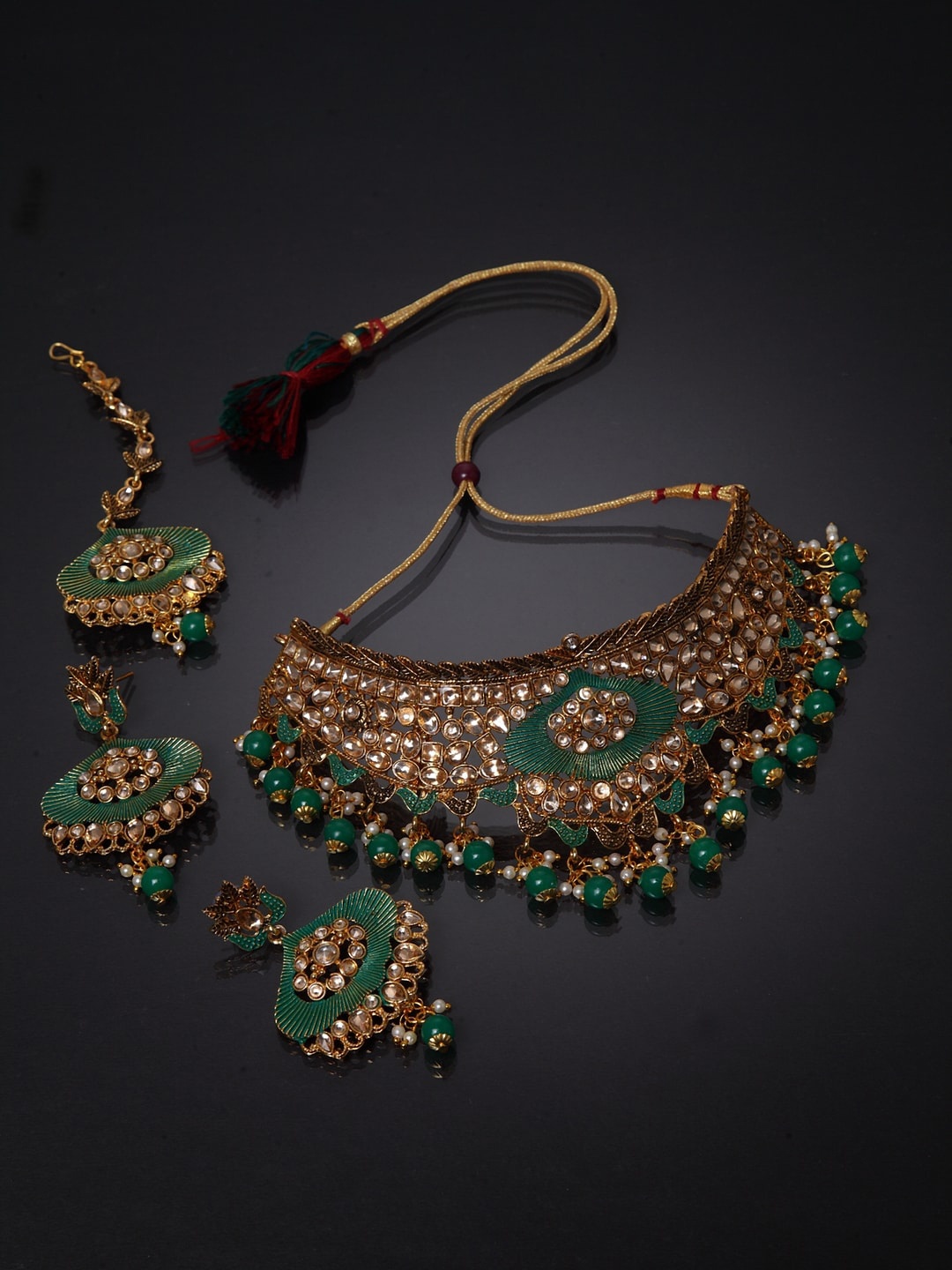 ANIKAS CREATION Gold-Plated White & Green Stone-Studded & Pearl Beaded Enamelled Jewellery Set
ANIKAS CREATION Gold-Plated White & Green Stone-Studded & Pearl Beaded Enamelled Jewellery Set