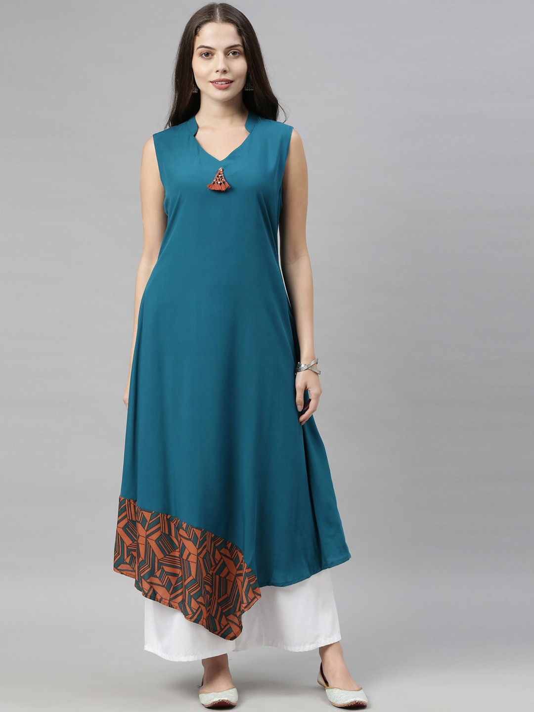 Neerus Women Teal Blue & Orange Solid Thread Work Detail Asymmetric A-Line Kurta
Neerus Women Teal Blue & Orange Solid Thread Work Detail Asymmetric A-Line Kurta