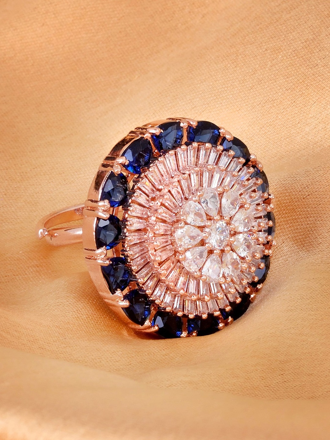 Saraf RS Jewellery Rose Gold-Plated White & Blue CZ-Studded Handcrafted Adjustable Finger Ring
Saraf RS Jewellery Rose Gold-Plated White & Blue CZ-Studded Handcrafted Adjustable Finger Ring