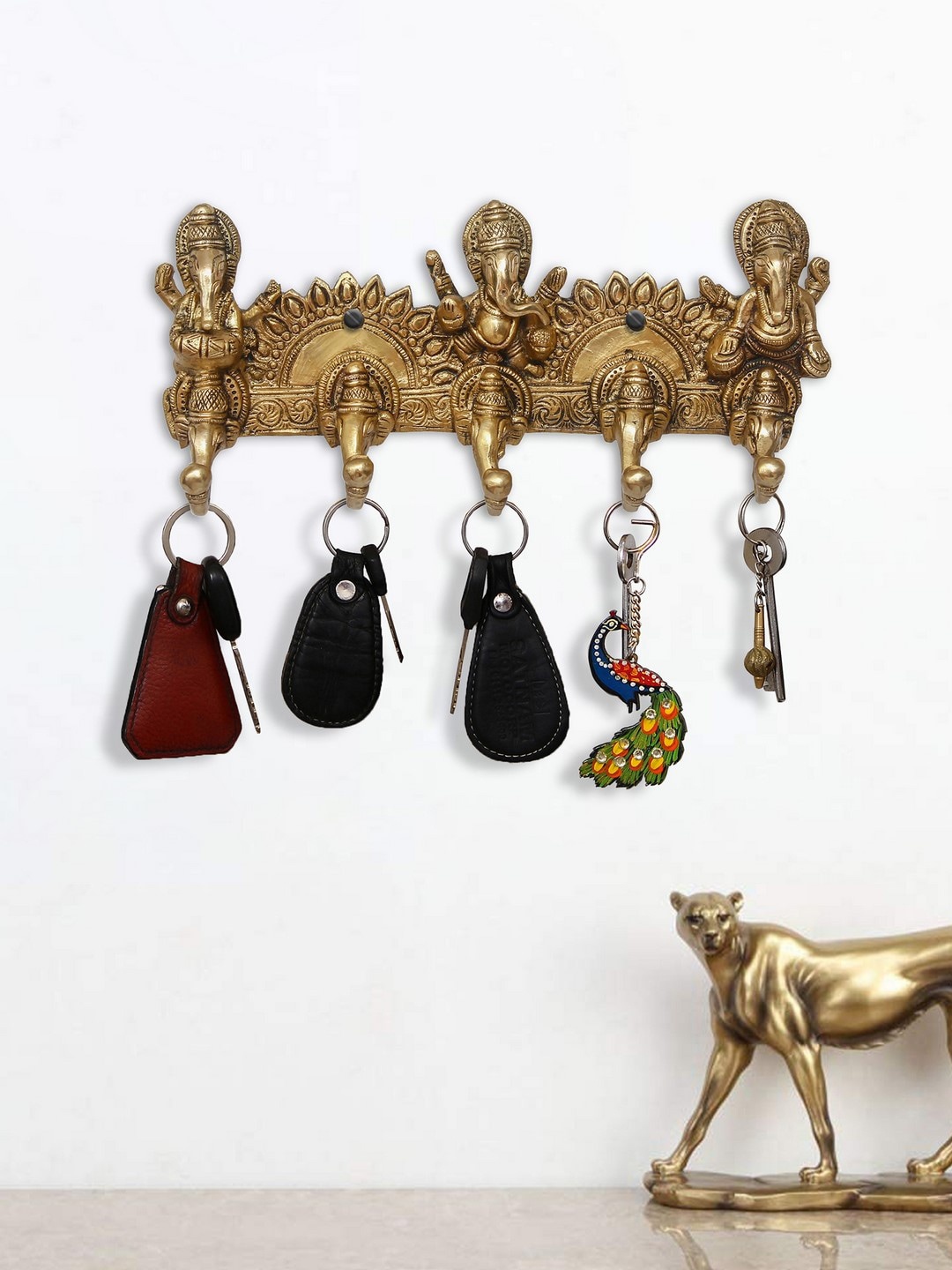 eCraftIndia Gold-Toned Musician Lord Ganesha Handcrafted Brass Key Holder With 5 Hooks
eCraftIndia Gold-Toned Musician Lord Ganesha Handcrafted Brass Key Holder With 5 Hooks