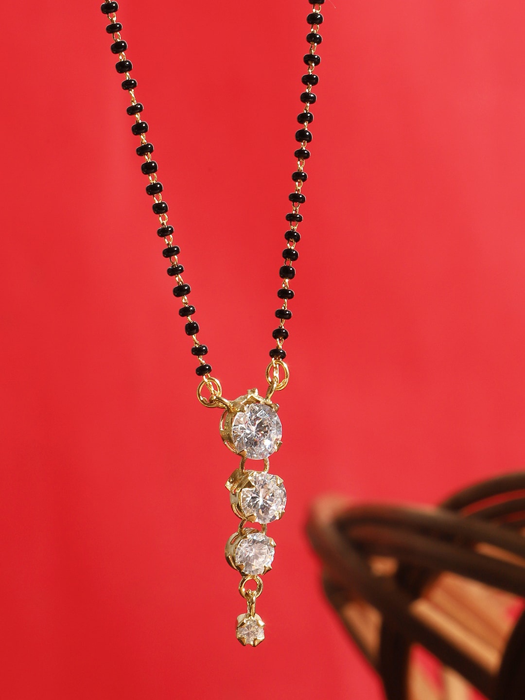 ANIKAS CREATION Gold-Plated Black & White Stone-Studded Beaded Traditional Mangalsutra
ANIKAS CREATION Gold-Plated Black & White Stone-Studded Beaded Traditional Mangalsutra
