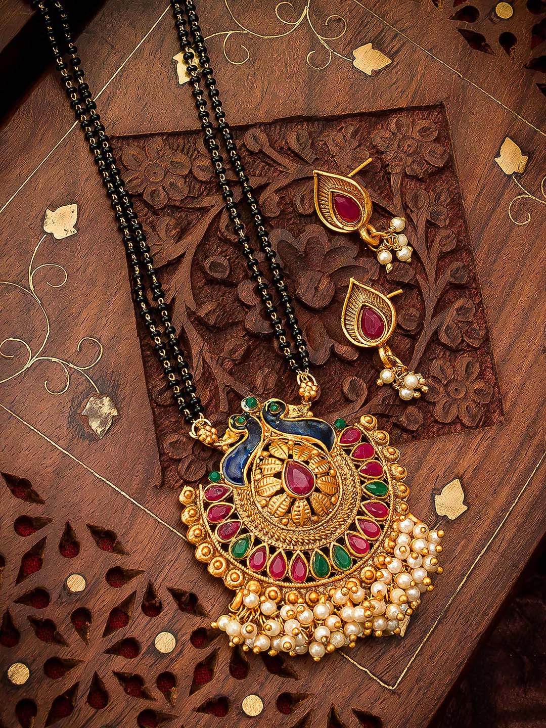 aadita Gold-Plated Black & Pink Meenakari & Pearl-Beaded Mangalsutra With Earrings
aadita Gold-Plated Black & Pink Meenakari & Pearl-Beaded Mangalsutra With Earrings