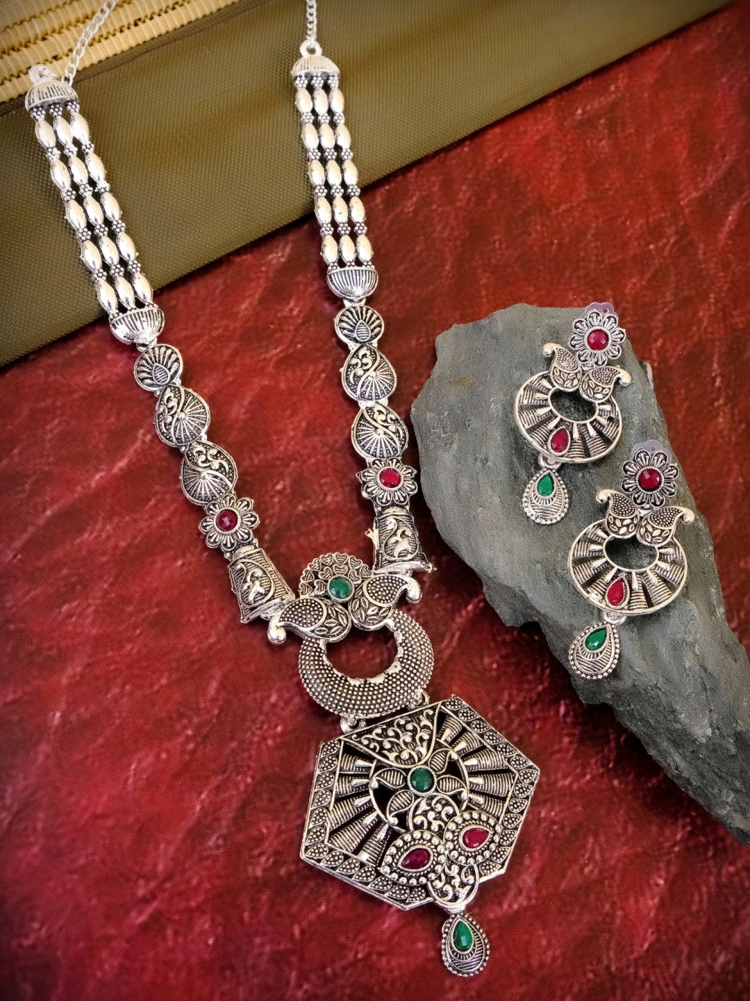 Crunchy Fashion Oxidised Silver-Plated Red & Green Stone-Studded Traditional Jewellery Set
Crunchy Fashion Oxidised Silver-Plated Red & Green Stone-Studded Traditional Jewellery Set