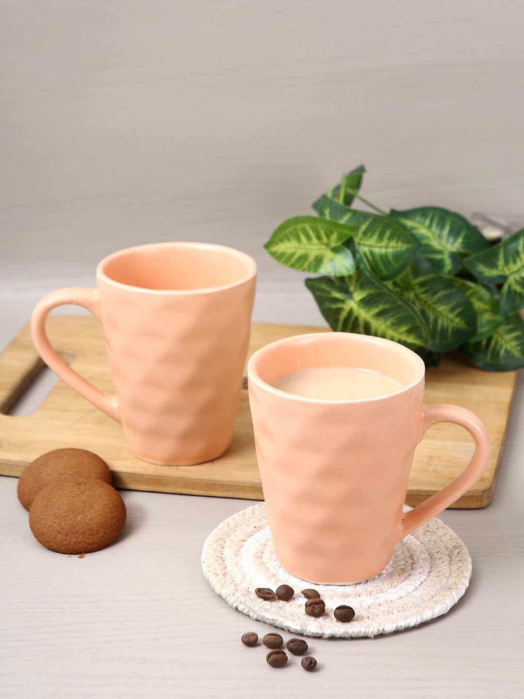 Aapno Rajasthan Set Of 2 Peach Textured Ceramic Glossy Mugs