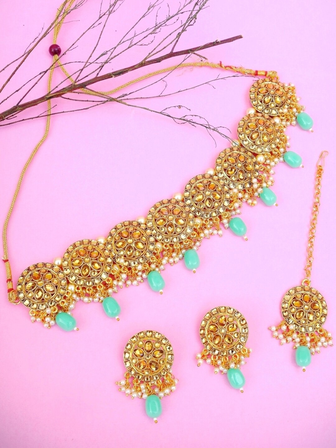 Crunchy Fashion Gold-Plated Beige & Green Stone-Studded Traditional Floral Pearl Choker Jewellery Set
Crunchy Fashion Gold-Plated Beige & Green Stone-Studded Traditional Floral Pearl Choker Jewellery Set