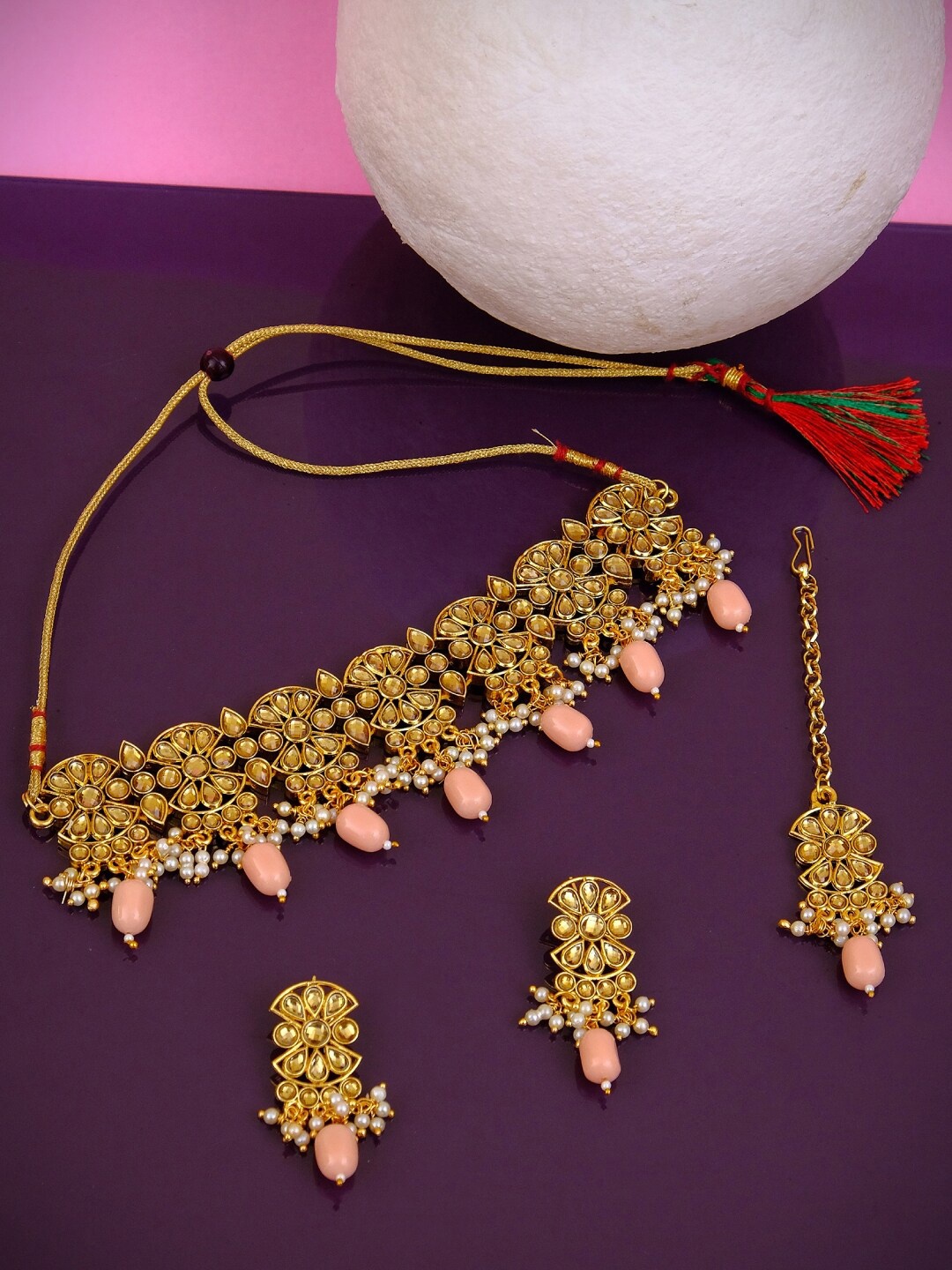 Crunchy Fashion Gold-Plated Pink & Off-White Stone-Studded Pearl Beaded Antique Jewellery Set
Crunchy Fashion Gold-Plated Pink & Off-White Stone-Studded Pearl Beaded Antique Jewellery Set