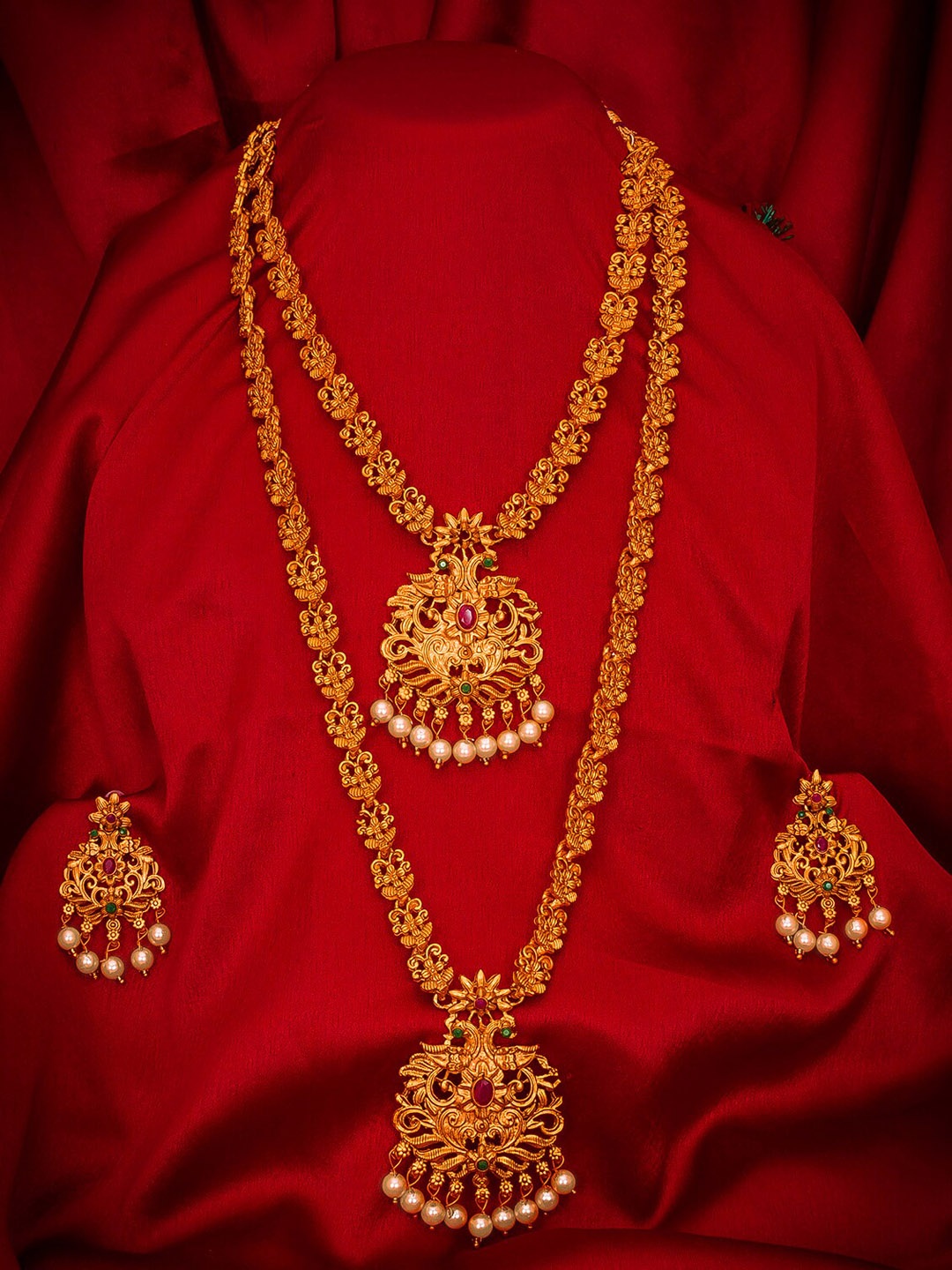 aadita Gold-Plated Magenta Pink & Green Stone-Studded Pearl Beaded Matinee Temple Jewellery Set
aadita Gold-Plated Magenta Pink & Green Stone-Studded Pearl Beaded Matinee Temple Jewellery Set