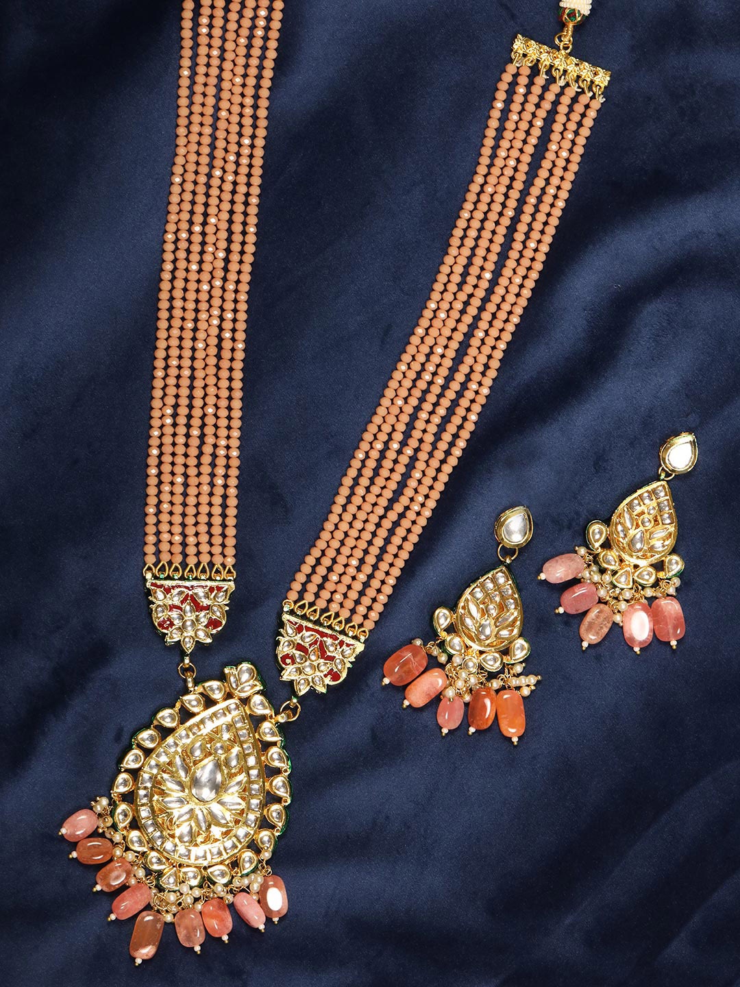 Priyaasi Gold-Plated Peach-Coloured & White Kundan-Studded & Beaded Handcrafted Jewellery Set
Priyaasi Gold-Plated Peach-Coloured & White Kundan-Studded & Beaded Handcrafted Jewellery Set