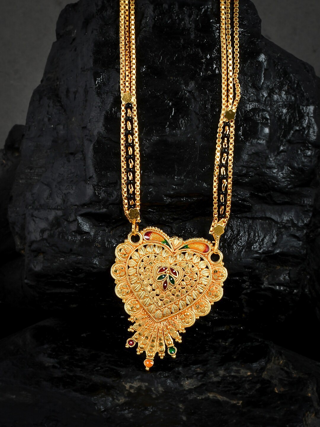 Silvermerc Designs Gold-Plated Black Beads & Stones-Studded Radha Pendant Mangalsutra
Silvermerc Designs Gold-Plated Black Beads & Stones-Studded Radha Pendant Mangalsutra