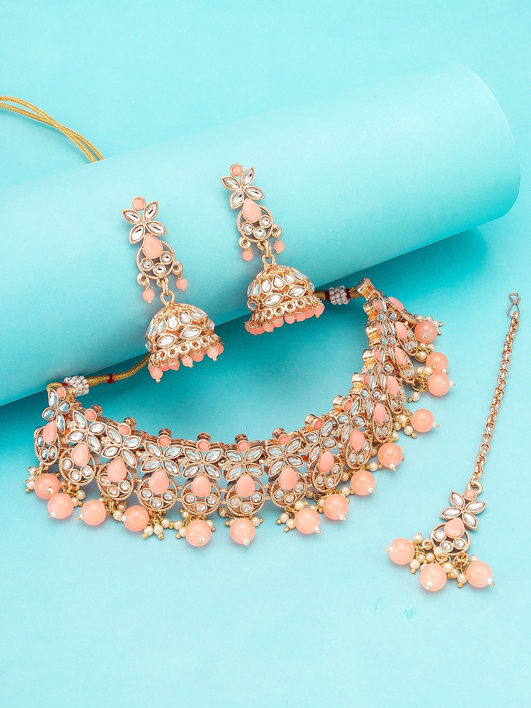 aadita Gold-Plated Peach-Coloured & White Stone-Studded & Beaded Temple Jewellery Set
aadita Gold-Plated Peach-Coloured & White Stone-Studded & Beaded Temple Jewellery Set