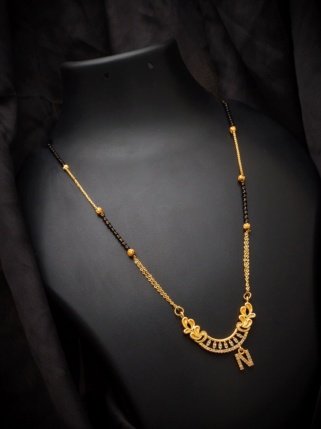 aadita Gold-Plated Black & White Stone-Studded Alphabet Initials Letter N Mangalsutra
aadita Gold-Plated Black & White Stone-Studded Alphabet Initials Letter N Mangalsutra