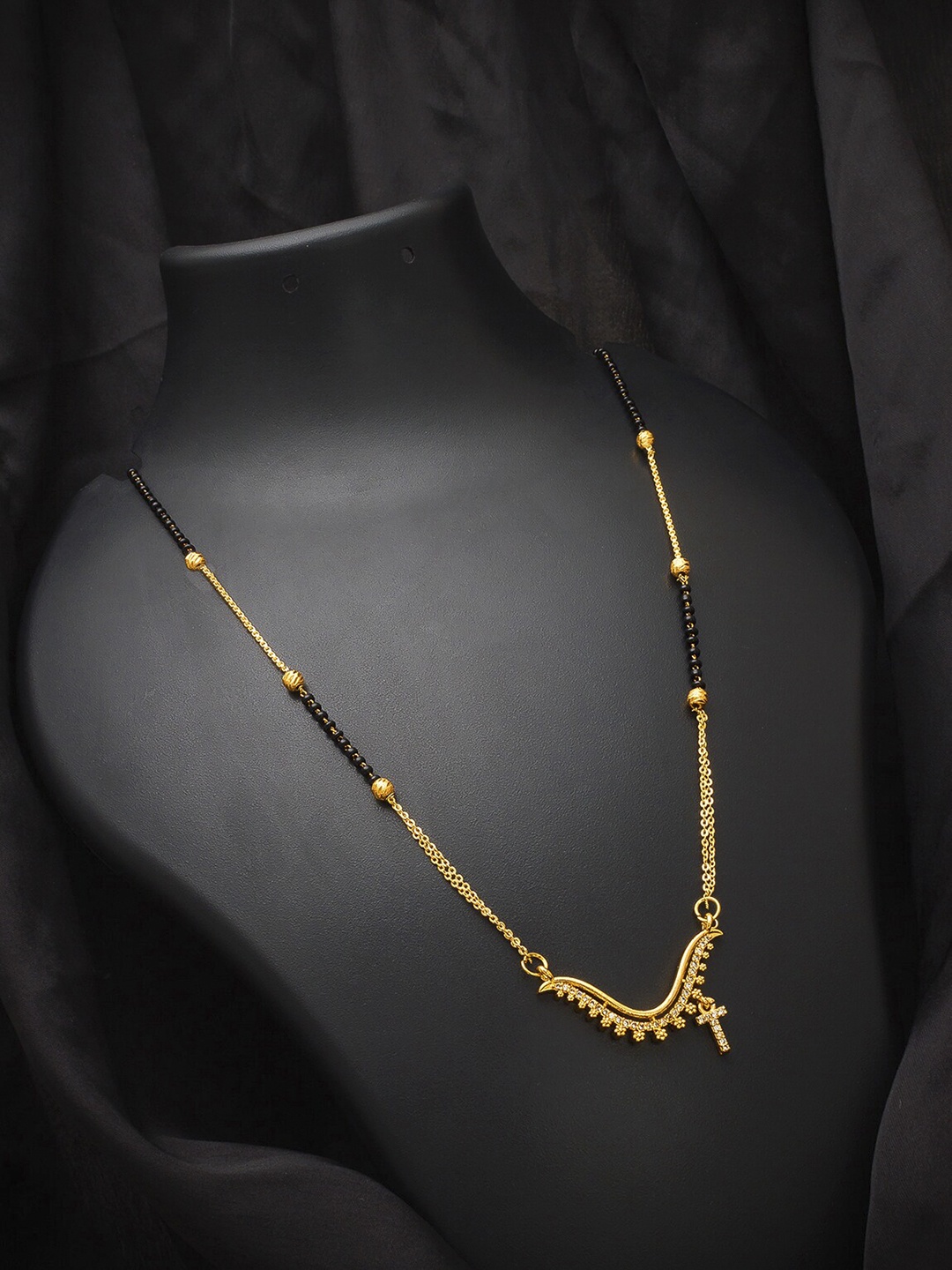 aadita Gold-Plated Gold-Toned Stones & Beads-Studded Alphabet Initials Letter T Mangalsutra
aadita Gold-Plated Gold-Toned Stones & Beads-Studded Alphabet Initials Letter T Mangalsutra