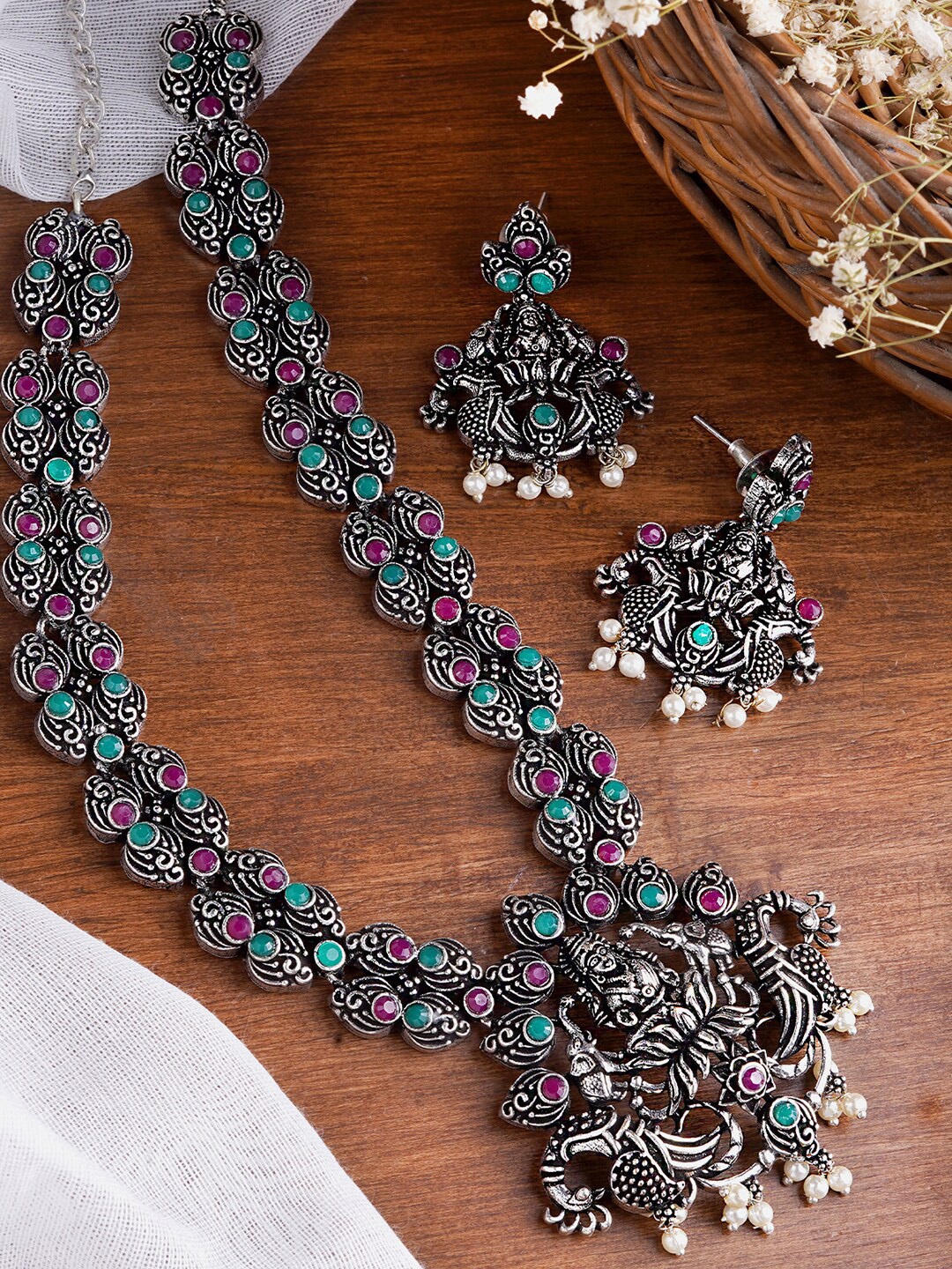 TEEJH Oxidized Silver-Plated Magenta Pink & Green Stone-Studded Beaded Temple Jewellery Set
TEEJH Oxidized Silver-Plated Magenta Pink & Green Stone-Studded Beaded Temple Jewellery Set