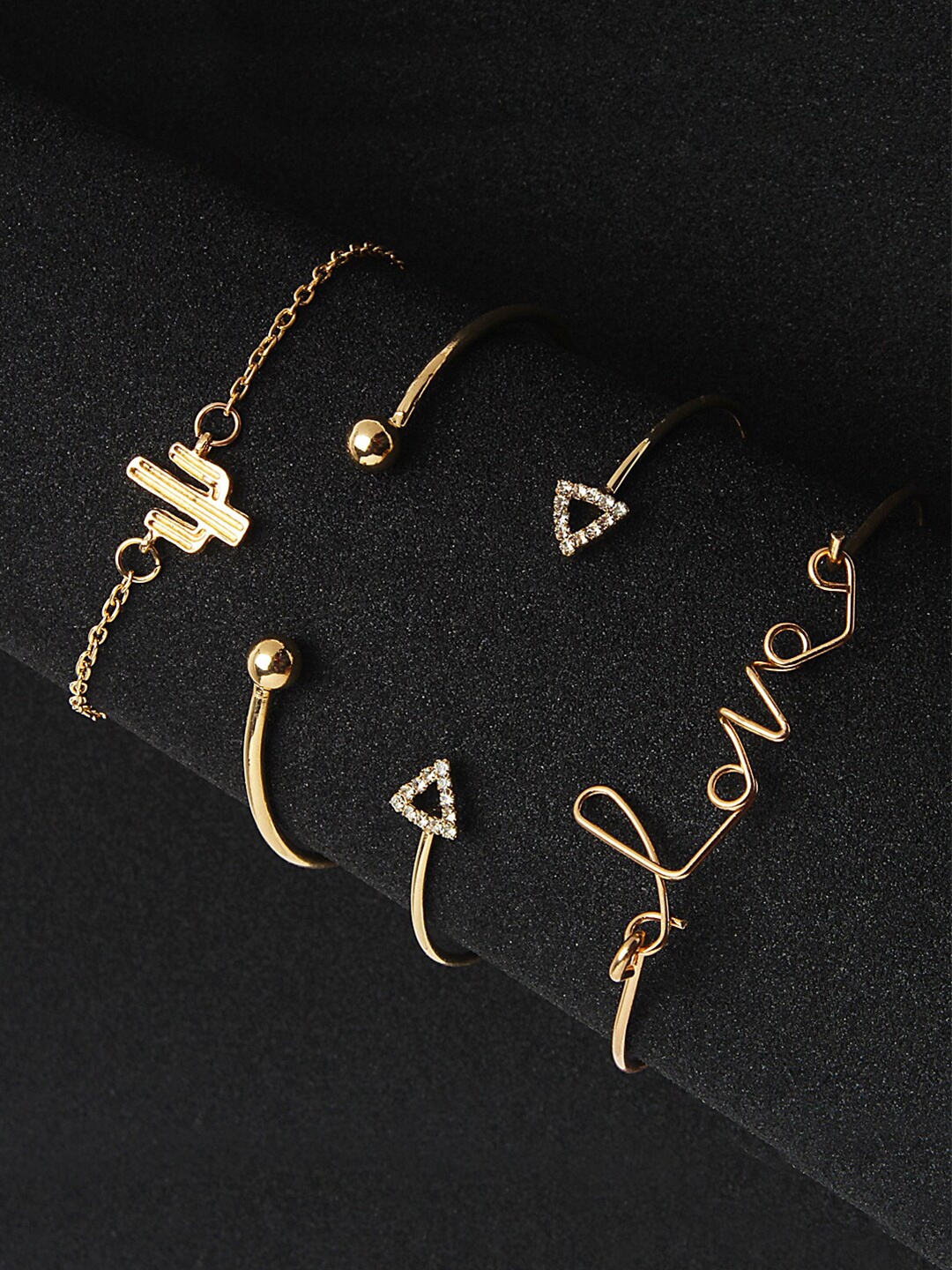 Shining Diva Fashion Women Set of 4 Gold-Toned Transparent Gold-Plated Charm Bracelet
Shining Diva Fashion Women Set of 4 Gold-Toned Transparent Gold-Plated Charm Bracelet