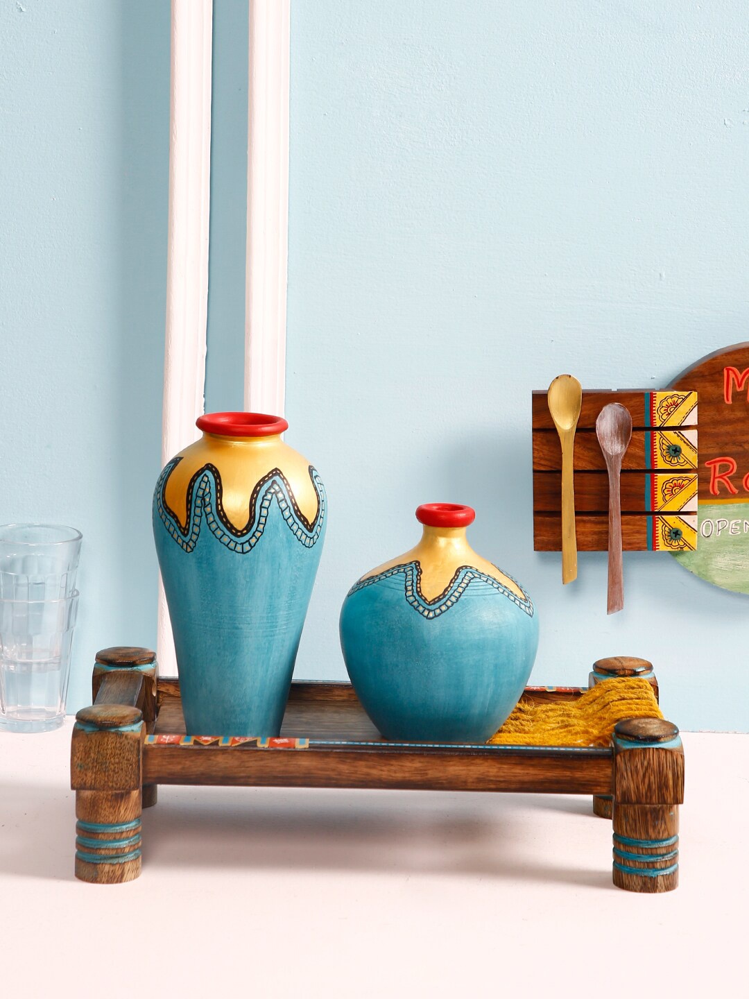 Aapno Rajasthan Set Of 2 Gold-Toned & Blue Hand-Painted Terracotta Vases With Wooden Charpai
Aapno Rajasthan Set Of 2 Gold-Toned & Blue Hand-Painted Terracotta Vases With Wooden Charpai