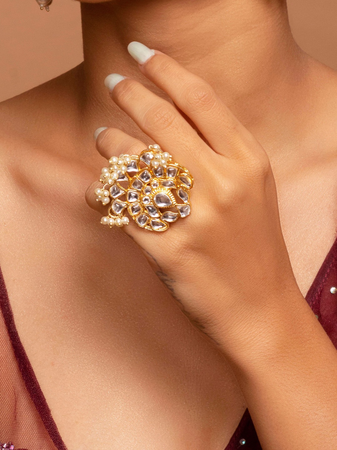 Fida Gold-Plated White Kundan-Studded & Pearl Beaded Handcrafted Adjustable Finger Ring
Fida Gold-Plated White Kundan-Studded & Pearl Beaded Handcrafted Adjustable Finger Ring