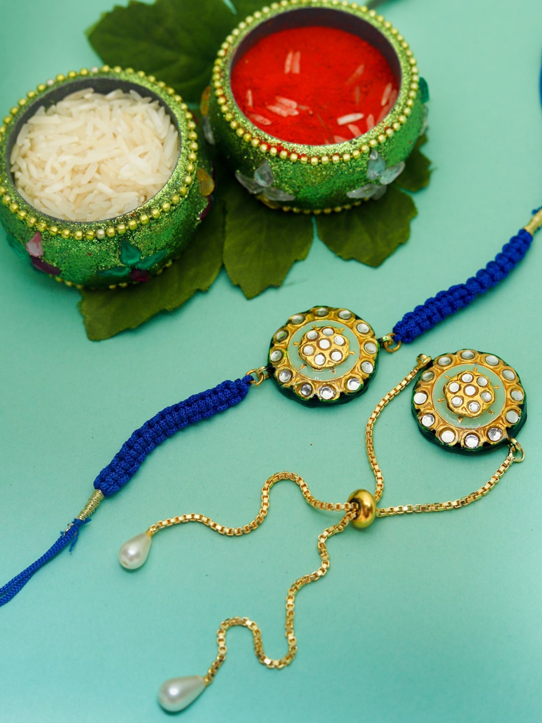 Shoshaa Pack Of 2 Kundan Reversible Meenakari Bhaiya Bhabi Rakhis With Roli Chawal, Green
Shoshaa Pack Of 2 Kundan Reversible Meenakari Bhaiya Bhabi Rakhis With Roli Chawal, Green